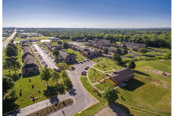 arial view of a neighborhood with houses and lawns